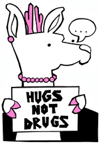 A deer holding a sign to say Hugs not Drugs